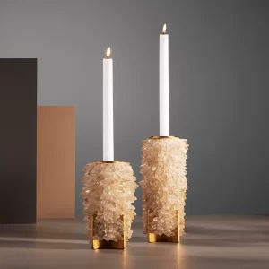 Pair of illuminated quartz crystal candle holders with gold-plated metal base, luxury home decor.