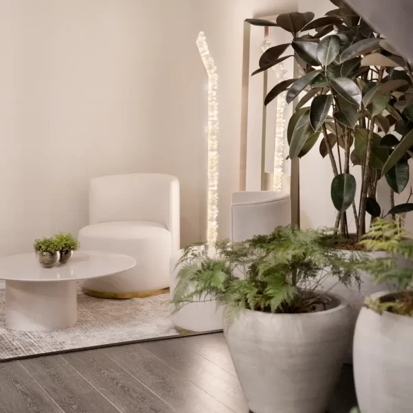 Contemporary Stone Floor Lamp lighting and iluminating a living room.