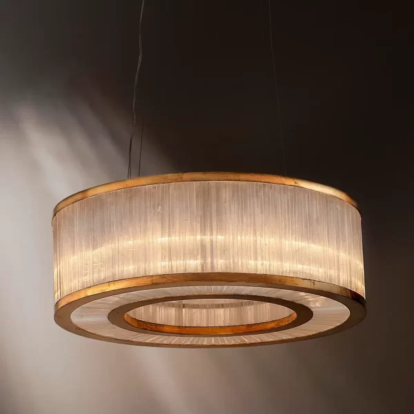 Dubai Chandelier in Warm Gold Leaf finish against a neutral dark studio background.