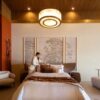 Dubai Selenite Lighting fixture in a luxury bedroom with Warm Gold Leaf finish.