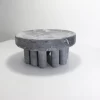 Small soapstone centerpiece on a white background from the Embrace collection.