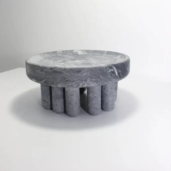 Small soapstone centerpiece on a white background from the Embrace collection.