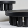 Par of Small black-painted wooden centerpiece and white background.