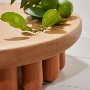 Small Angelin wood centerpiece decorated with citrus fruits.