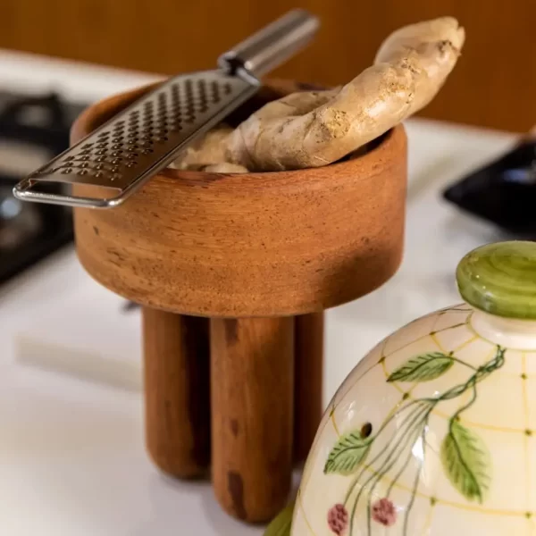 Small Angelin wood bowl with ginger in a kitchen setting.