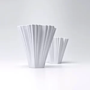 Elegant pair of modern fine porcelain vases by Haus of Aurah, white background, featuring sleek design for luxury American interiors.