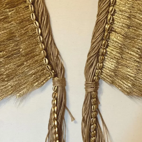 Close-up of the Indigenous Natural Fiber Headdress Antunes shell design on the Headdress, Indigenous Natural Fiber, Antunes, in a neutral environment.