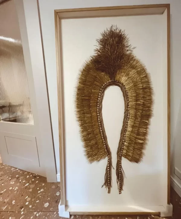 Canvas background of the Headdress, Indigenous Natural Fiber, Antunes, shown in a neutral setting.