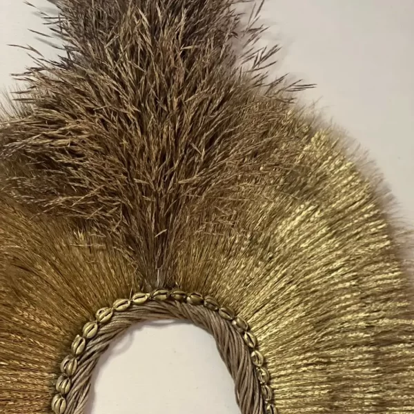 Close-up of the Headdress, Indigenous Natural Fiber, Antunes, highlighting the intricate wheat and shell design.
