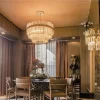Dining room with a round table and Paris Deluxe Wall Sconce.