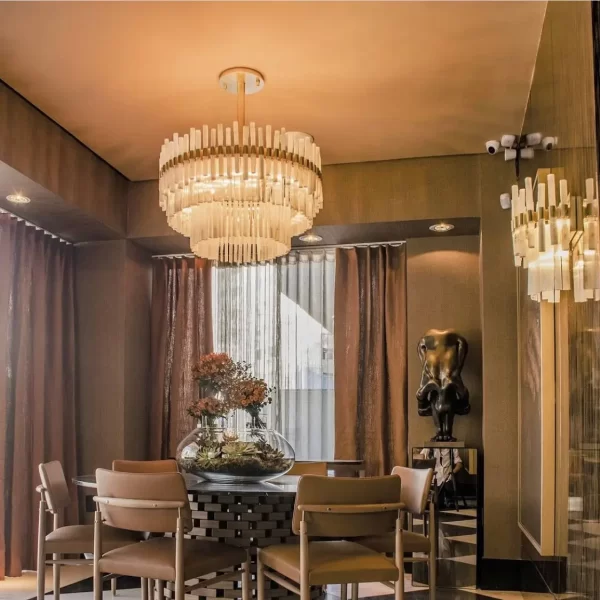 Dining room with a round table and Paris Deluxe Wall Sconce.