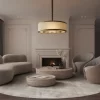 Chandelier casting a warm glow in a living room with a fireplace.