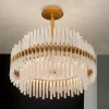 Paris Deluxe Selenite Chandelier in a neutral setting with a black background and Warm Gold Leaf finish