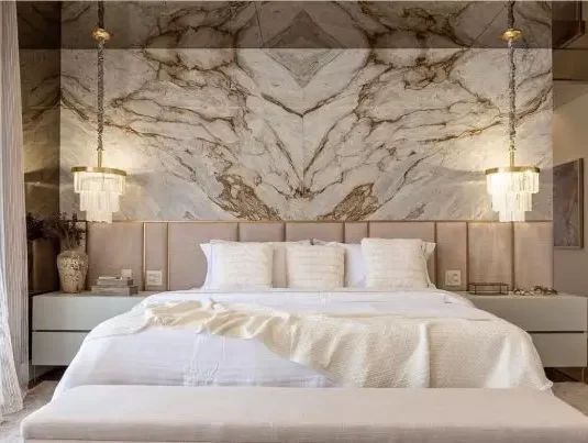 Honeymoon suite with Petit London Natural Stone Lighting Fixture and golden chains.