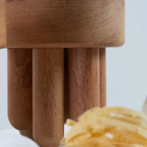 Side view of a small soapstone bowl showing design details.