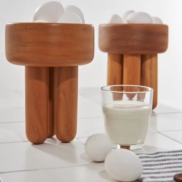 Pair of Wooden Bowls Decor with eggs and milk.