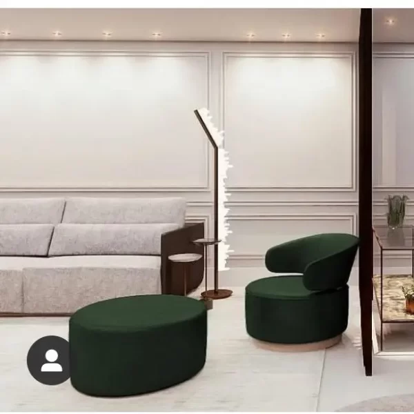 Rome Floor Lamp in Selenite finished in Antique Bronze illuminating a living room.