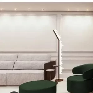 Rome Floor Lamp in Selenite finished in Antique Bronze illuminating a living room.