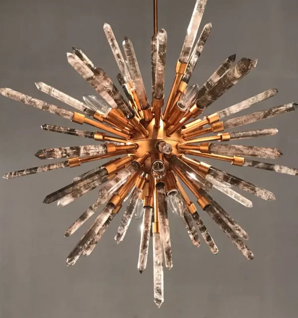 Image of a sophisticated studio featuring a Barcelona chandelier with Warm Gold Leaf finish and Smoked Quartz, radiating warm and elegant light.