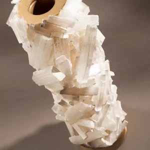 Close-up studio image of the Alexxa I Natural Stone Candle Holder, highlighting the selenite detailing and metal frame finish.