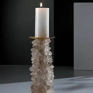 Desiree V White Quartz Candle Holder in a sophisticated setting, illuminated by a burning candle, showcasing its radiant beauty and practical elegance.