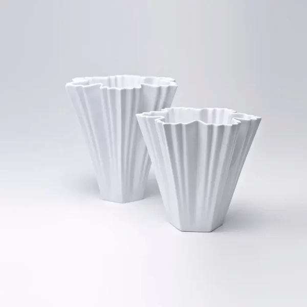 Pair of ICE I Fine Porcelain Vases in matte white on a white background.