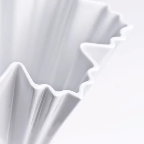 Details of a single ICE I Fine Porcelain Vase in matte white on a white background
