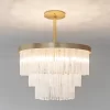Selenite chandelier Grand London illuminated, showcasing the translucent glow of selenite crystals.