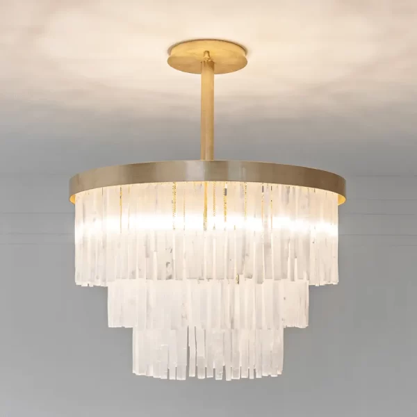 Selenite chandelier Grand London illuminated, showcasing the translucent glow of selenite crystals.