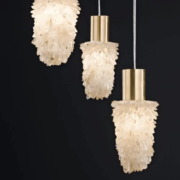 Set of 3 Milky Quartz Pendant Lamps Dublin Slim with Warm Silver Leaf Finish against Black Background.