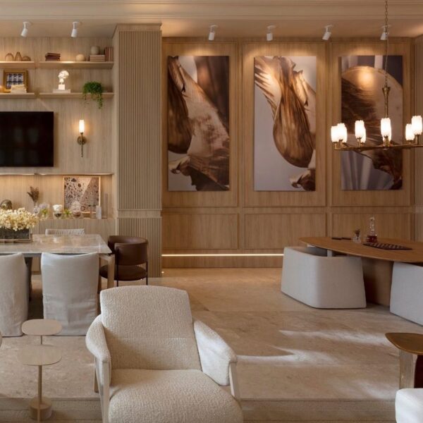 Side view of a vintage ceramic chandelier over a dining table in a large room.