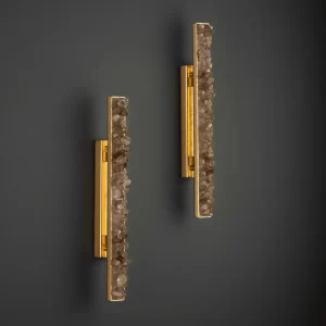Pair of Quartz LED Wall Lamps New York 24″ with smoked quartz and warm gold leaf finish, installed side by side on a dark wall, creating an elegant ambiance.