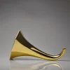 Porcelain Gramophone Speaker gold on a white background with a fine porcelain speaker for smartphones, featuring a retro design.