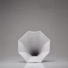 Front view of Matte white porcelain gramophone speaker on a white background.