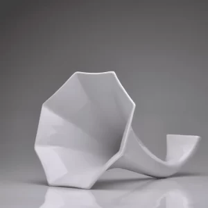 Matte white porcelain gramophone on a white background.
