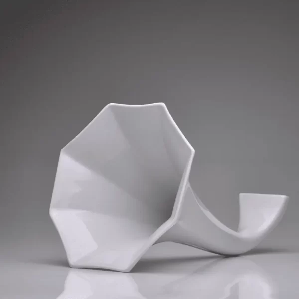 Matte white porcelain gramophone on a white background.