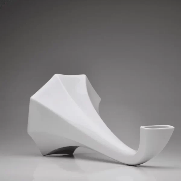Matte white porcelain gramophone speaker with a focus on the speaker horn on a white background.