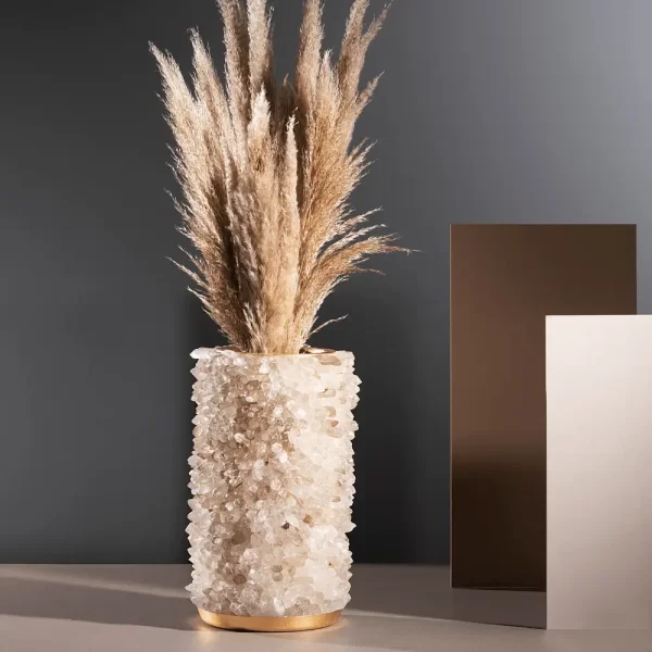 White Quartz Vase with warm gold leaf finish, with wheat straw, captured in natural light for a warm ambiance.