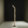 Rome Floor Lamp in White Quartz with Antique Bronze Finish against a black studio background.