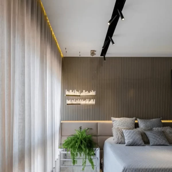 Selenite LED Pendant Light Lisbon in Antique Bronze Finish, Positioned Beside a Bed in a Cozy Interior Bedroom Suite