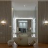 Par of selenite lightins Dubai adding charming to a sophisticated restroom.