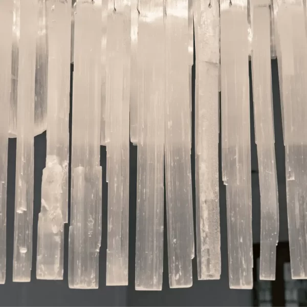 Close-up of Grand London light fixture highlighting intricate selenite crystal details.