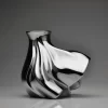 Single porcelain vase with external painting in silver on a neutral background.