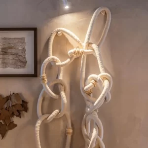 Wooden Cotton Chain Link Wall Decor Hanging on Illuminated Wall