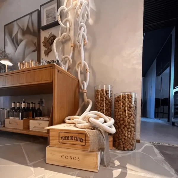 Wooden Cotton Chain Link Wall Decor hanging on a living room wall, enhancing the space with a natural Bohemian style.