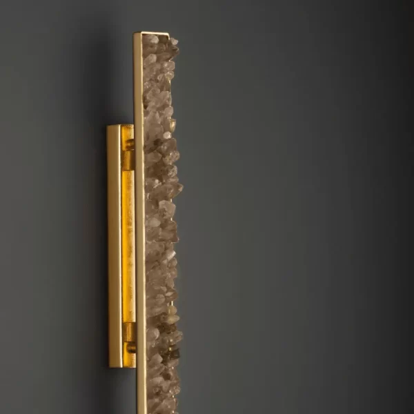 Zoom on Quartz LED Wall Lamp New York 24″ with smoked quartz and warm gold leaf finish, against a black background, highlighting design details.